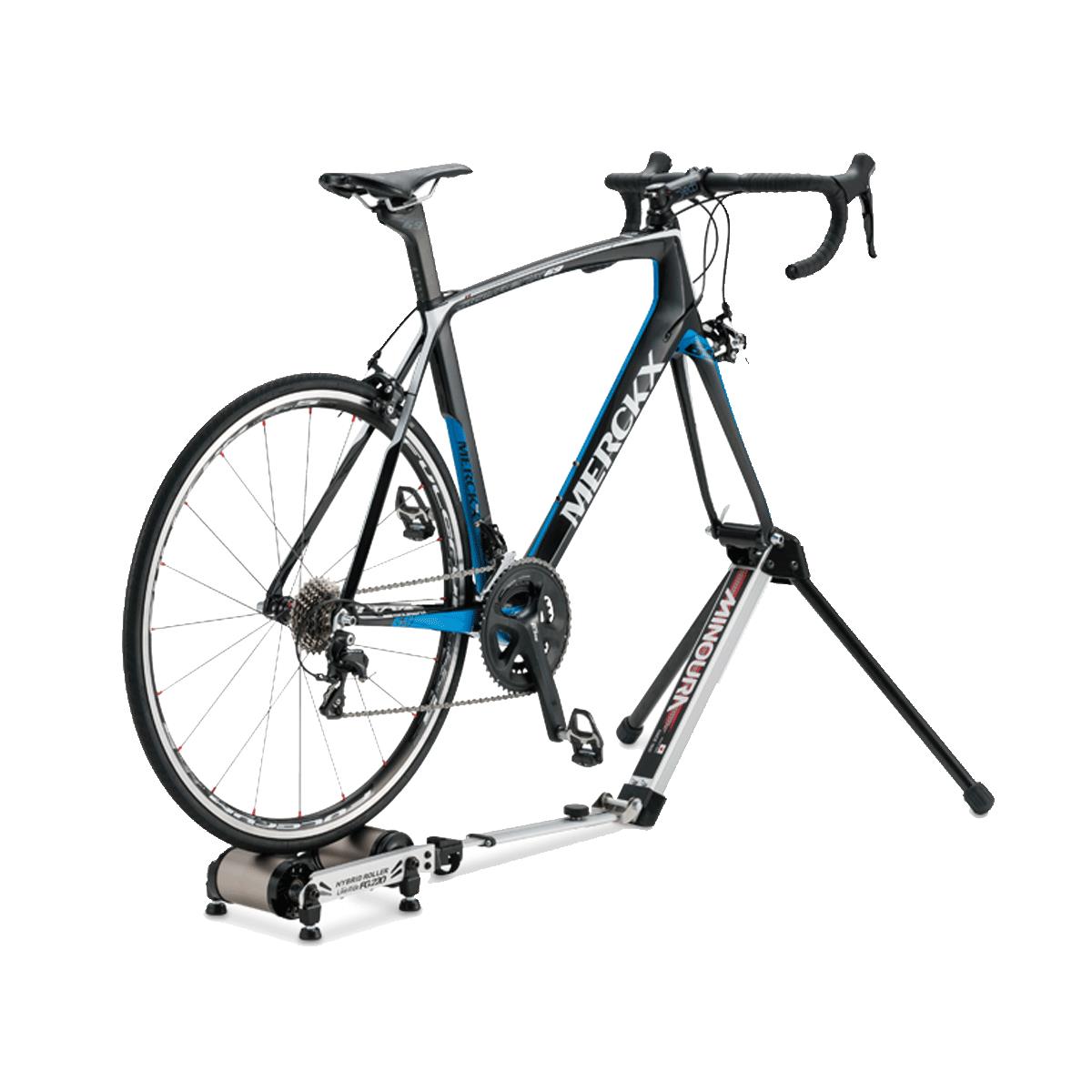 Minoura FG220 hybrid roller bike trainer with road bike, folded position and storage bag