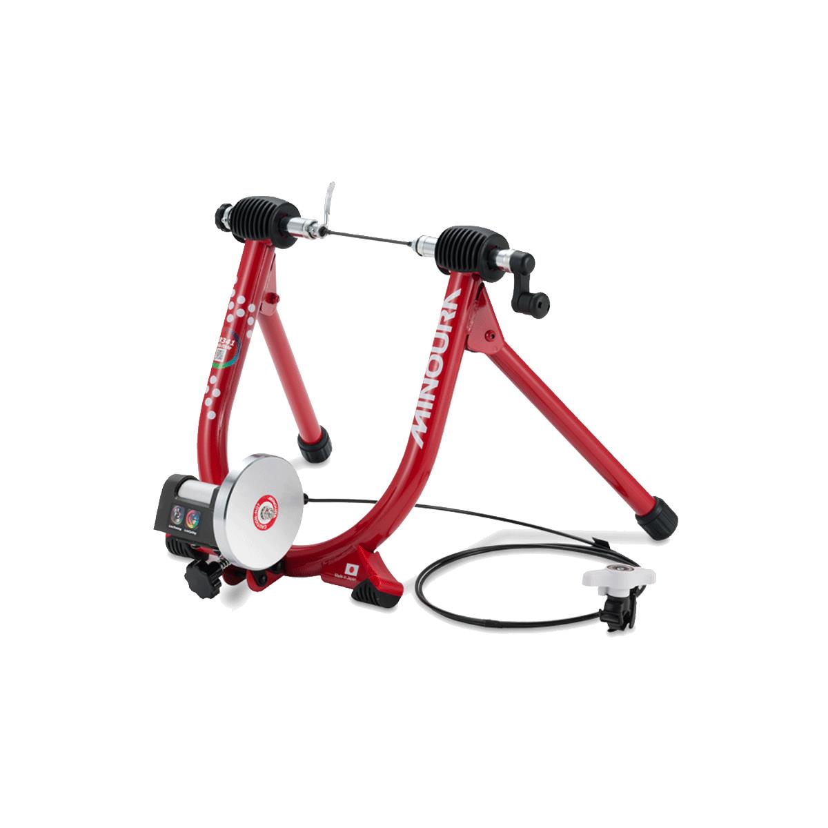 Minoura LR341 magnetic turbo trainer with road bike mounted, showing remote shifter and resistance unit