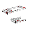 Minoura Live Roll R500 bicycle rollers with road bike, showing alloy drum design and folded storage position